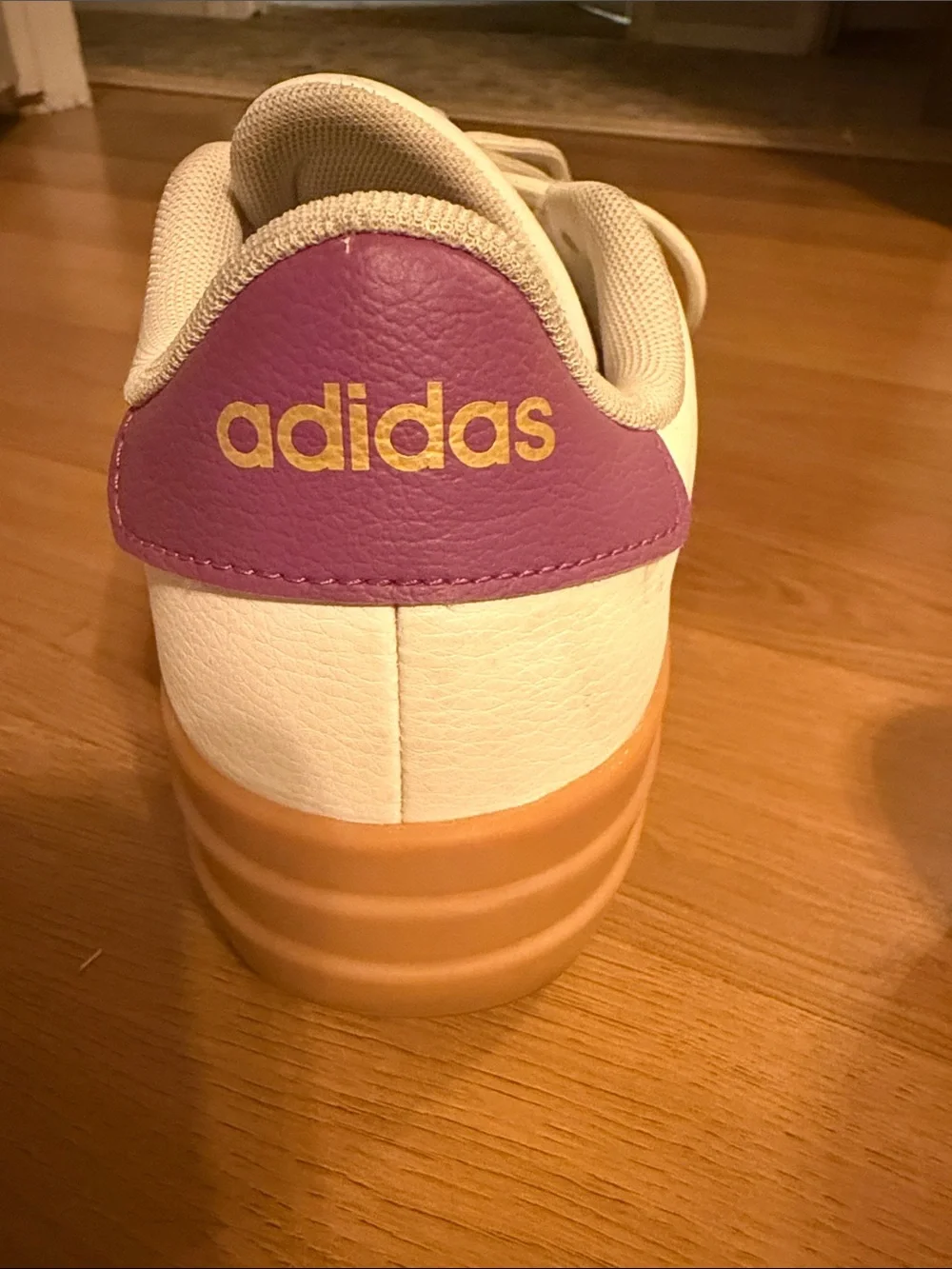 adidas women’s White Sneakers with Gum Sole and Light Green Stripes